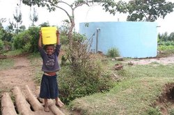 The water tank and a young water carrier